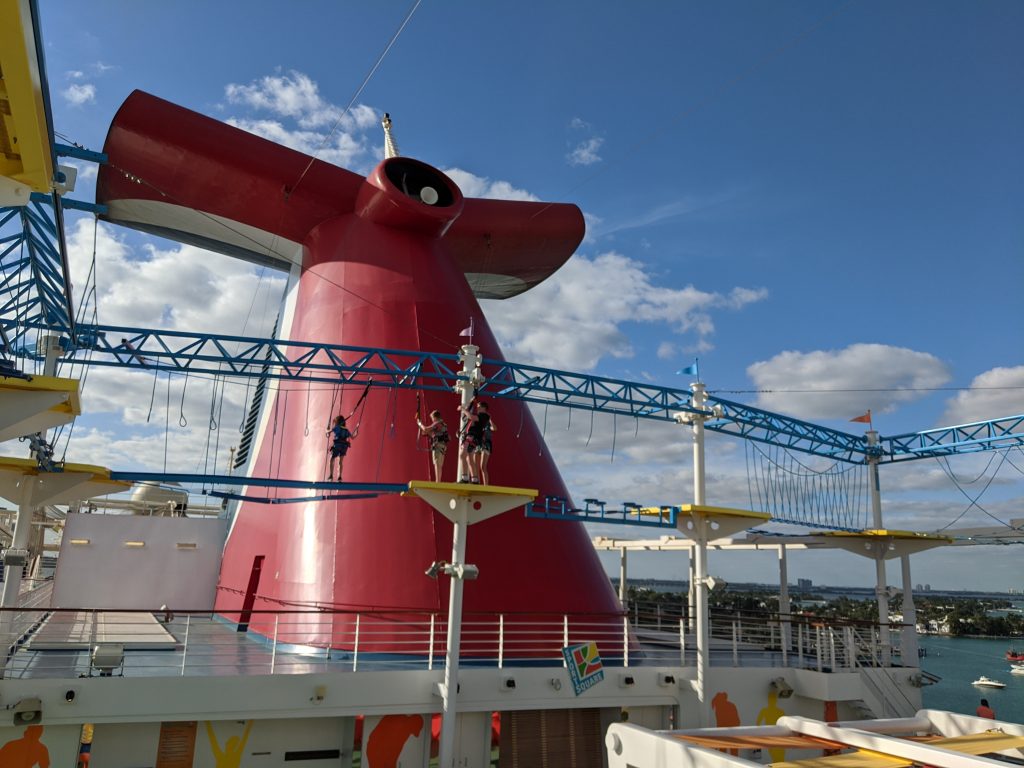 Ropes course and red carnival funnel on a cruise ship