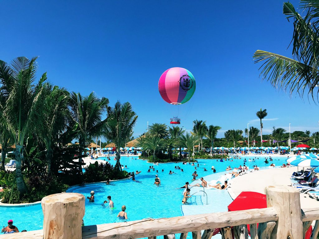 Large freshwater pool with hot air balloon in background at Perfect Day at CocoCay