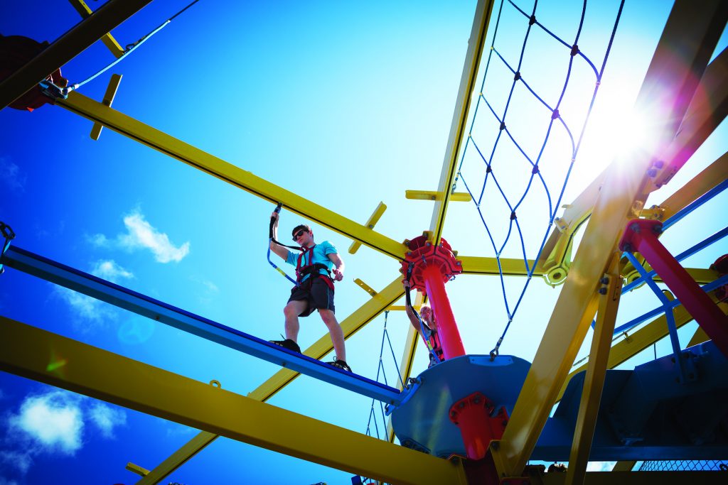 Man on a 2-story ropes course on the Norwegian Breakaway