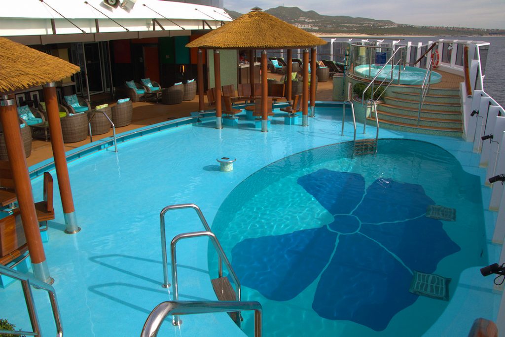 Havana deck area with 2 hot tubs and an infinity pool on the Carnival Panorama