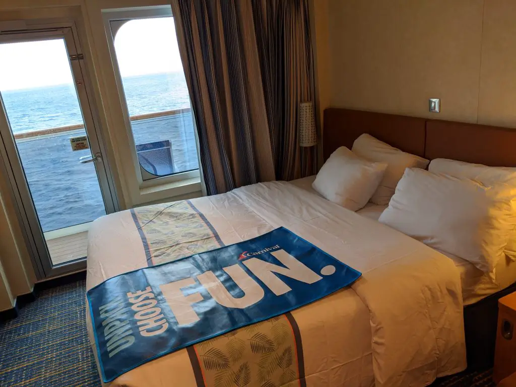 King Bed in a balcony cabin on the Carnival Pride