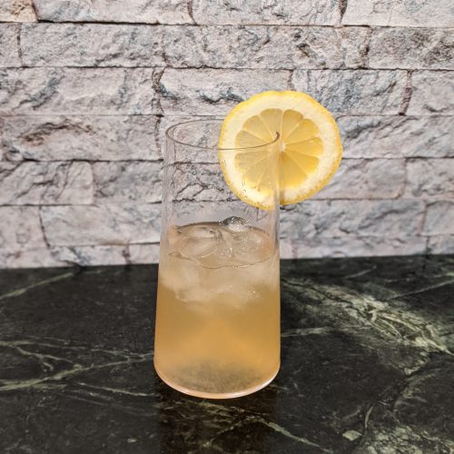 Cocktail glass with Carnival's Alchemy Bar Lynchburg Lemonade