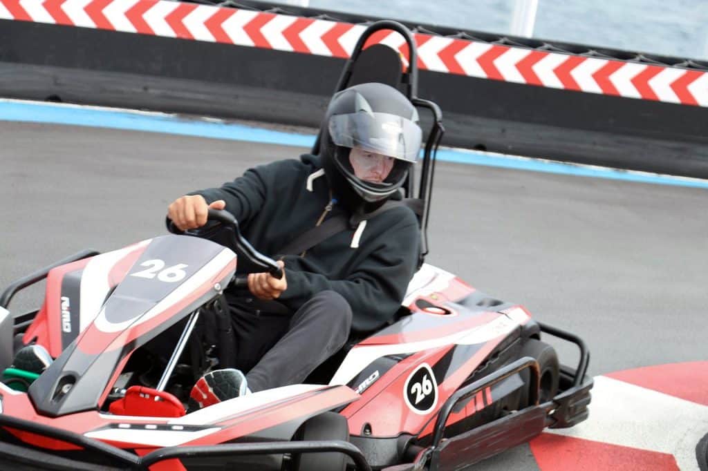 Man driving go kart on Norwegian Bliss Speedway race track