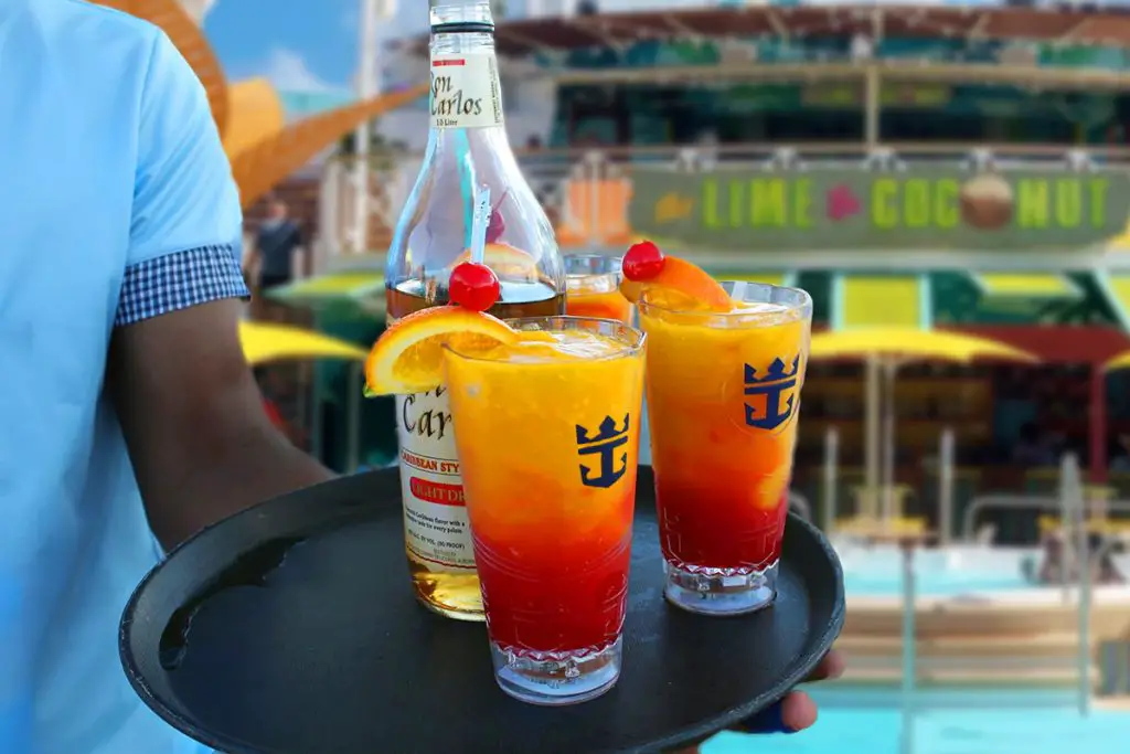 Man with frozen royal caribbean drinks by line and coconut bar