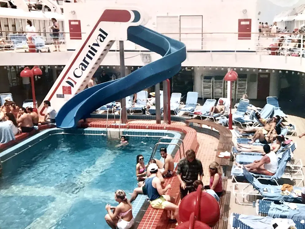 water slide, pool and chairs on cruise ship deck on carnival jubilee