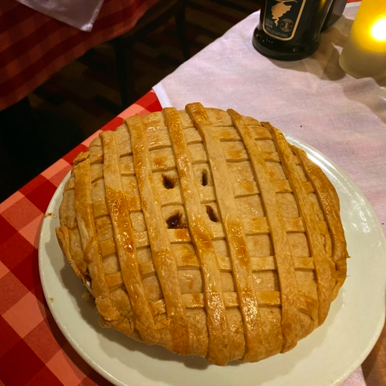 Apple pie on red tablecloth