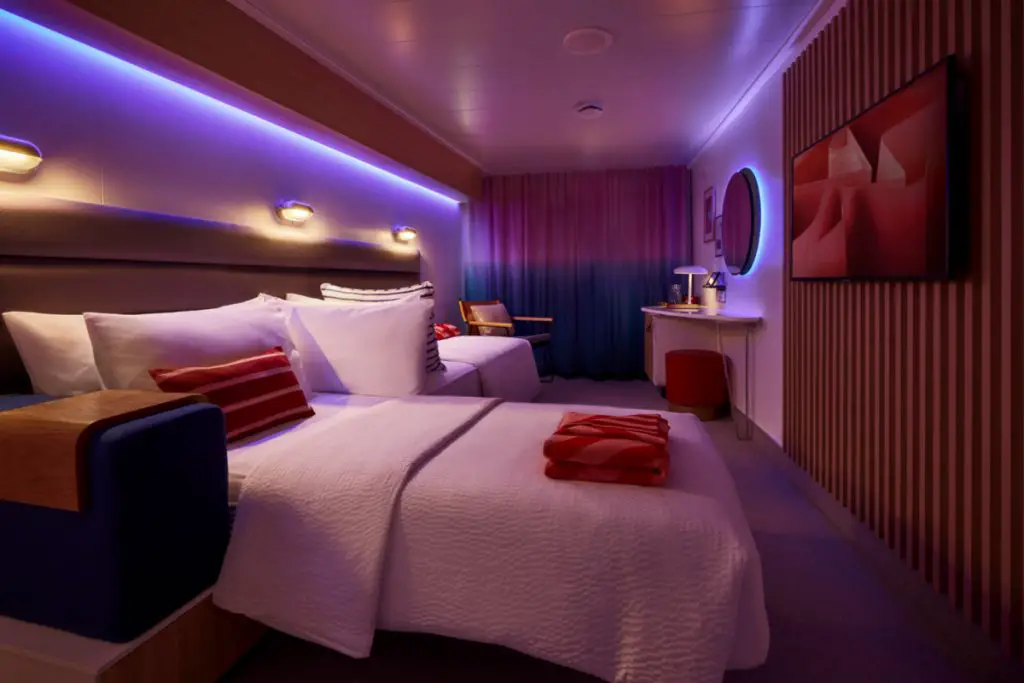 Virgin Voyages Scarlet Lady Cabin at night with LED lighting