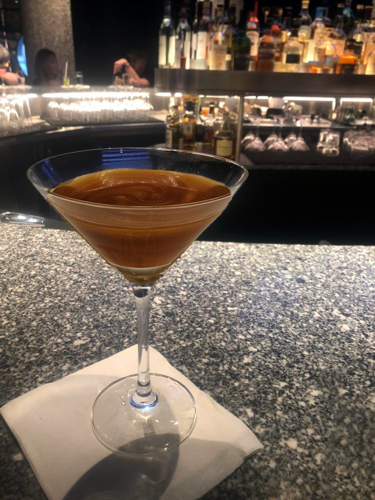 Carnivals golden galaxy cocktail on the bar