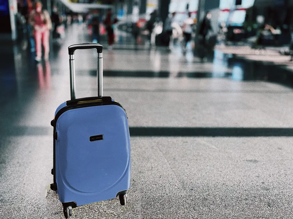 blue suitcase in airport