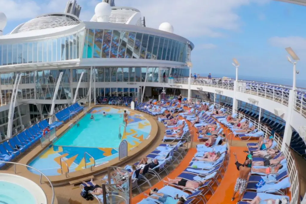 The main pool, Perfect Storm water slides, and loungers on Royal Caribbean