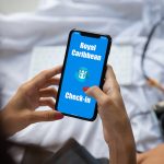 woman checking in using royal caribbean app