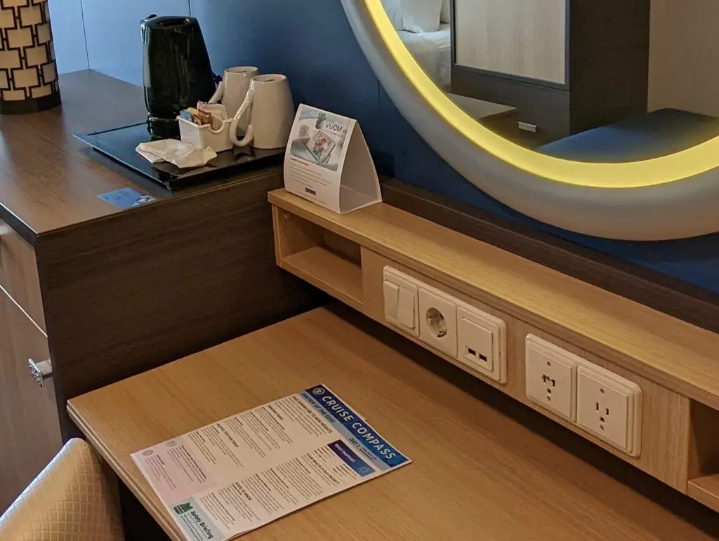 outlets at desk on ovation of the seas balcony cabin