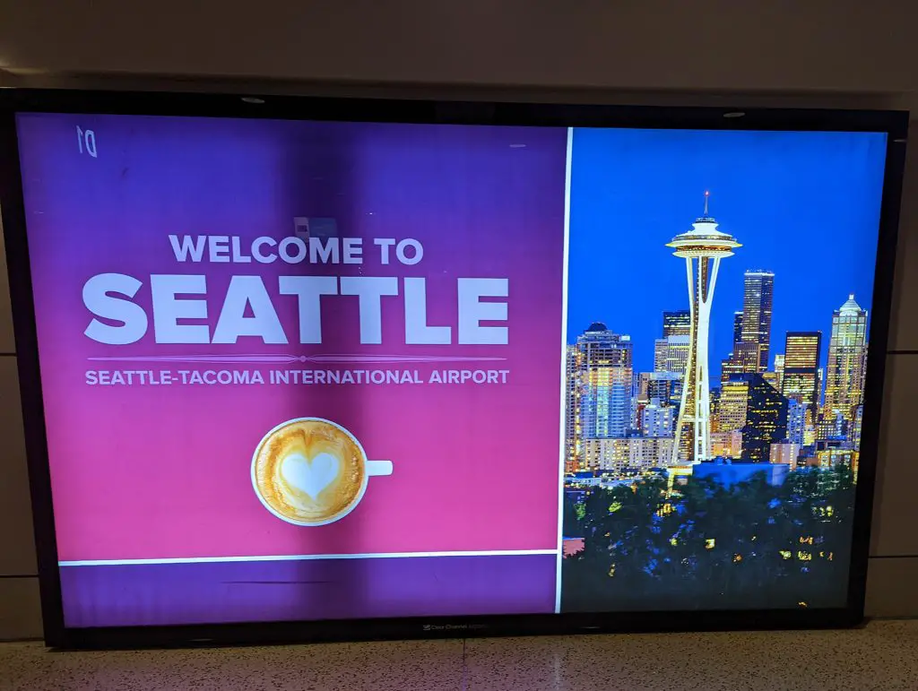 welcome to Seattle sign at airport