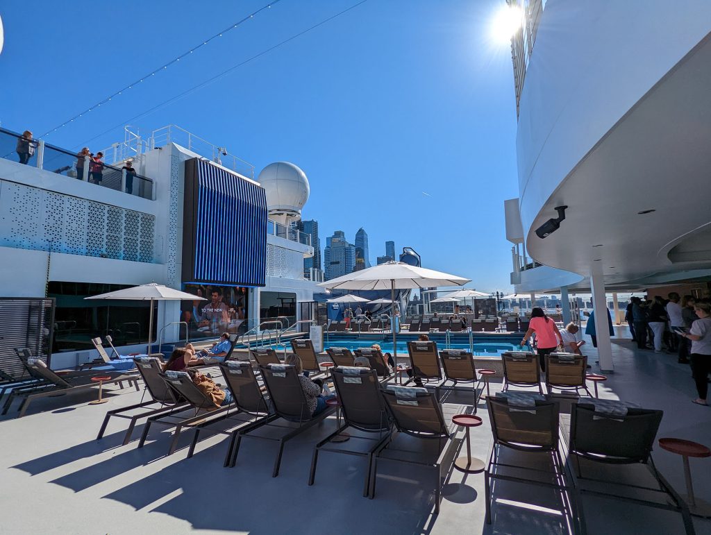 main pool area with video screen and loungers