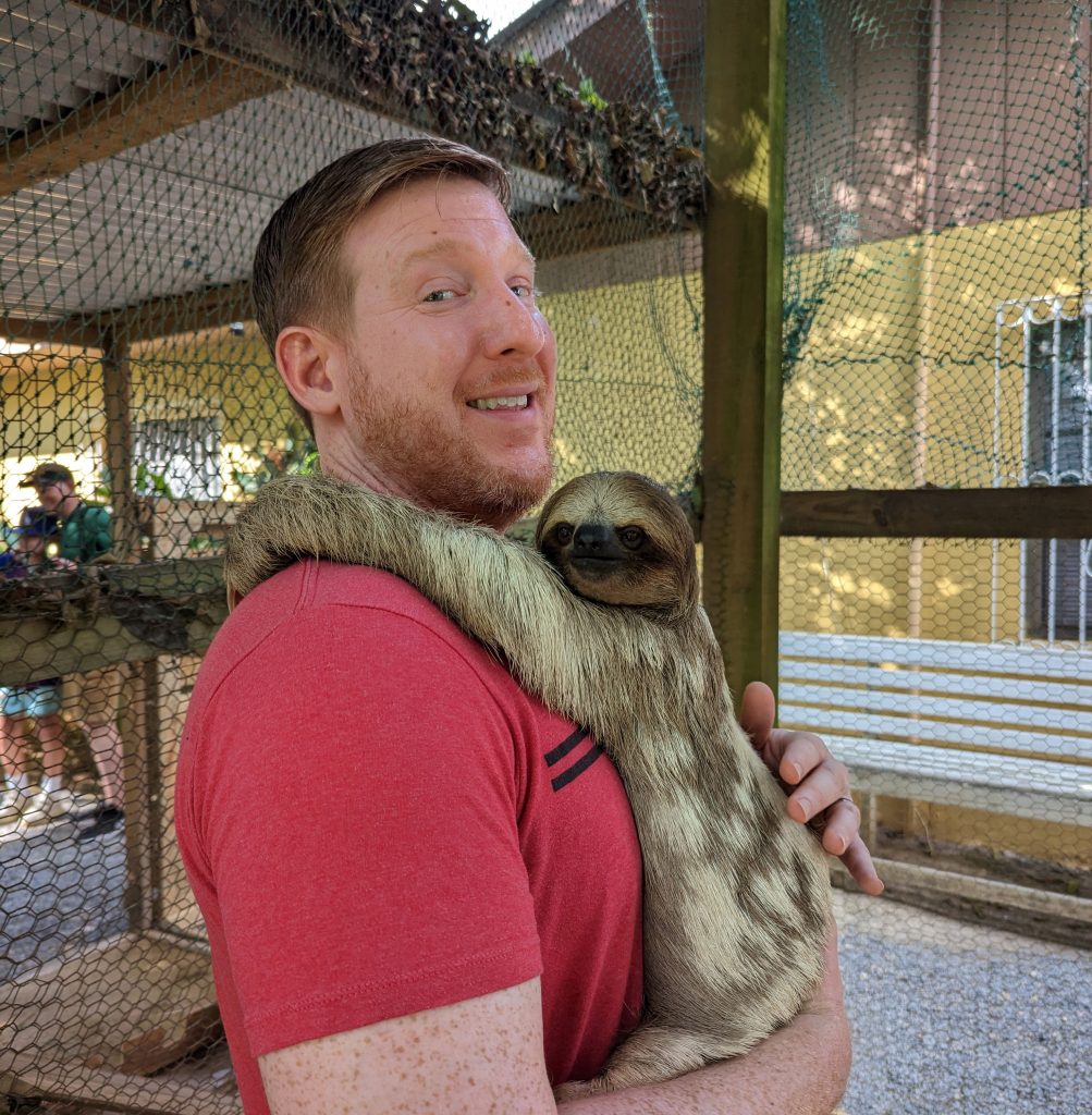holding a sloth