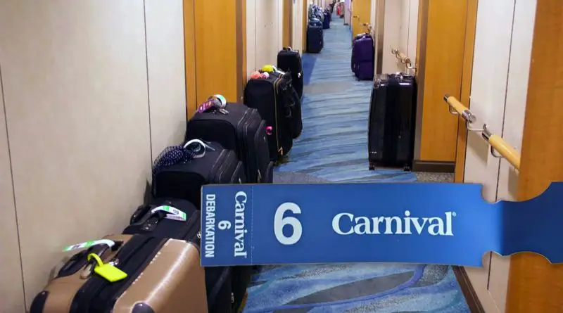hallway with suitcases and carnival luggage tag