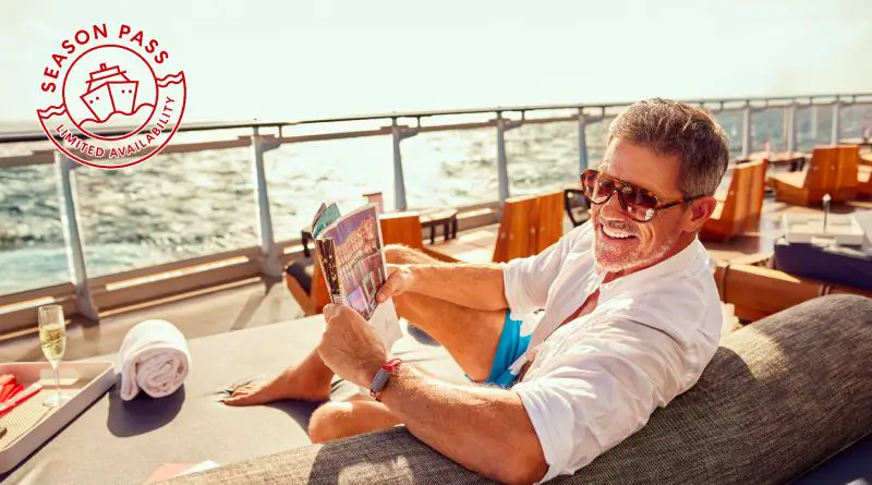 man reading paper on a cruise ship