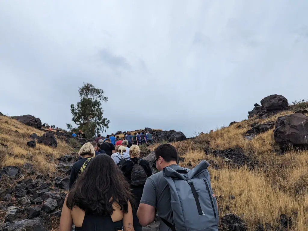 people climbing a mountain path