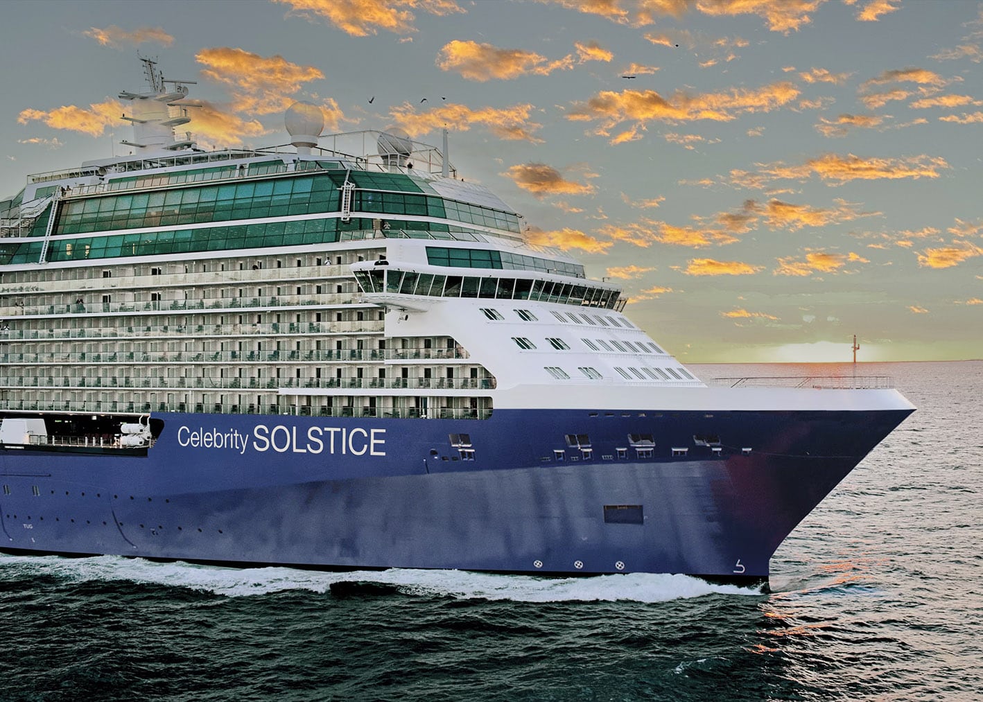 celebrity solstice sailing at sunset