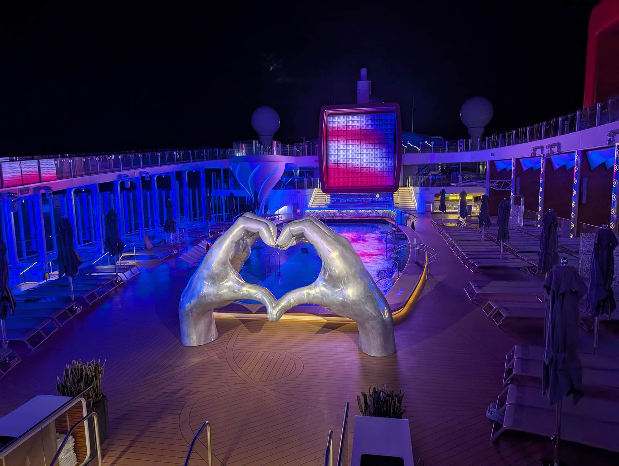 celebrity apex pool deck at night