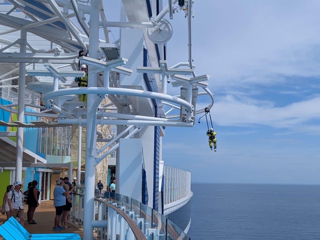 jumpsuit on crown's edge over water