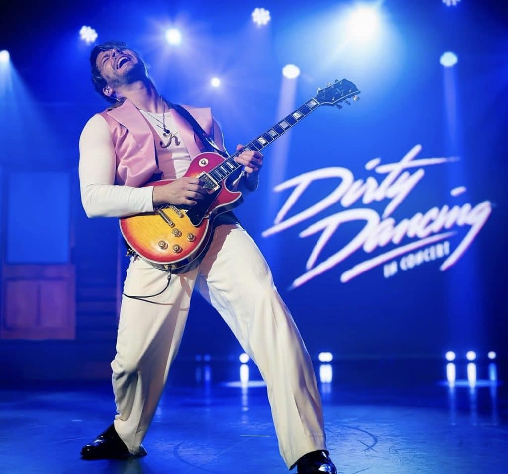 man play guitar with dirty dancing in the background
