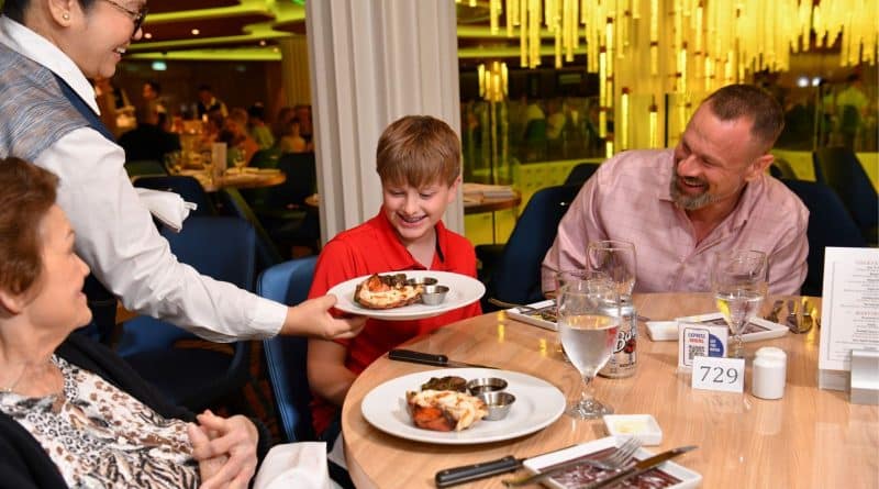 family at main dining room on carnival ship