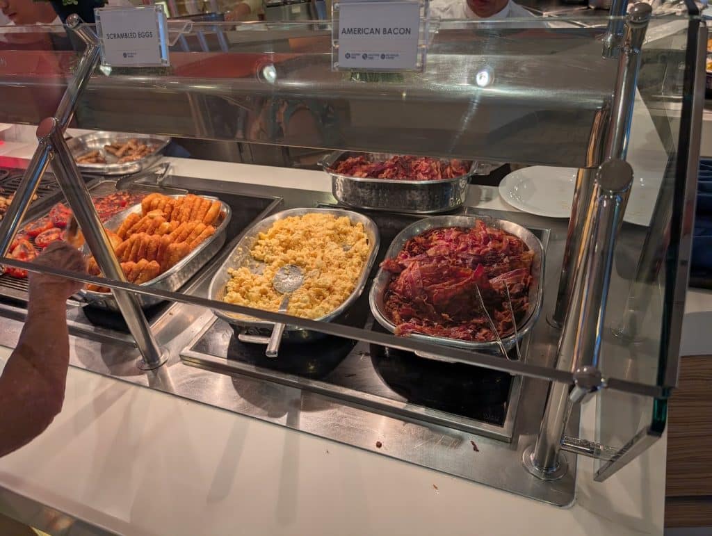 celebrity reflection breakfast buffet options of bacon and hashbrowns