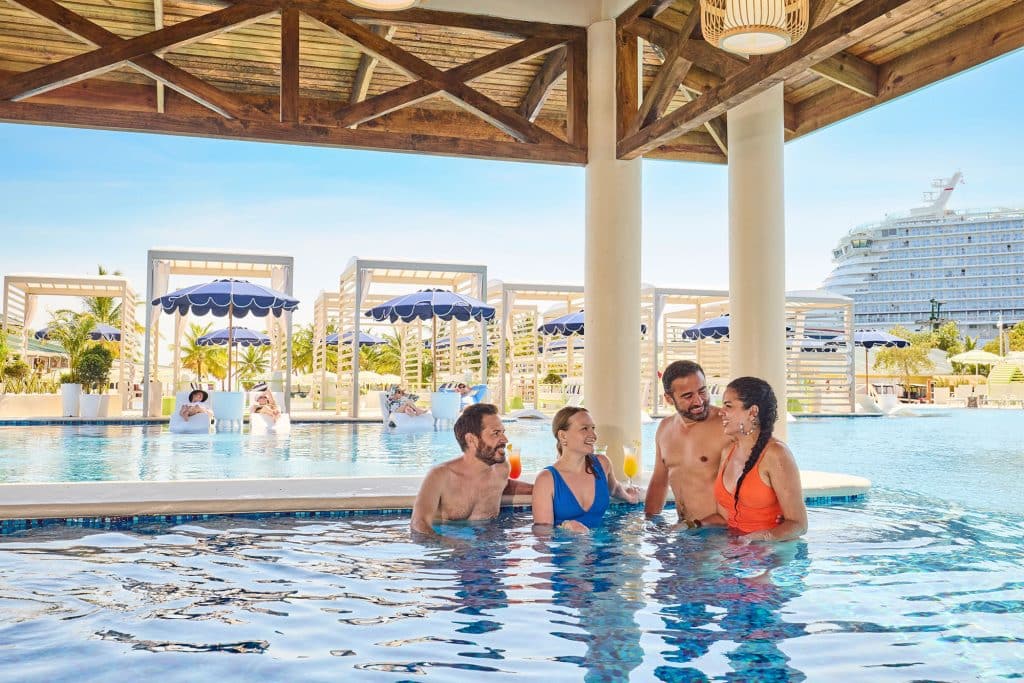 adults at a swim up bar