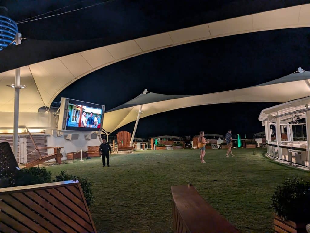 lawn club movie screen at night on reflection